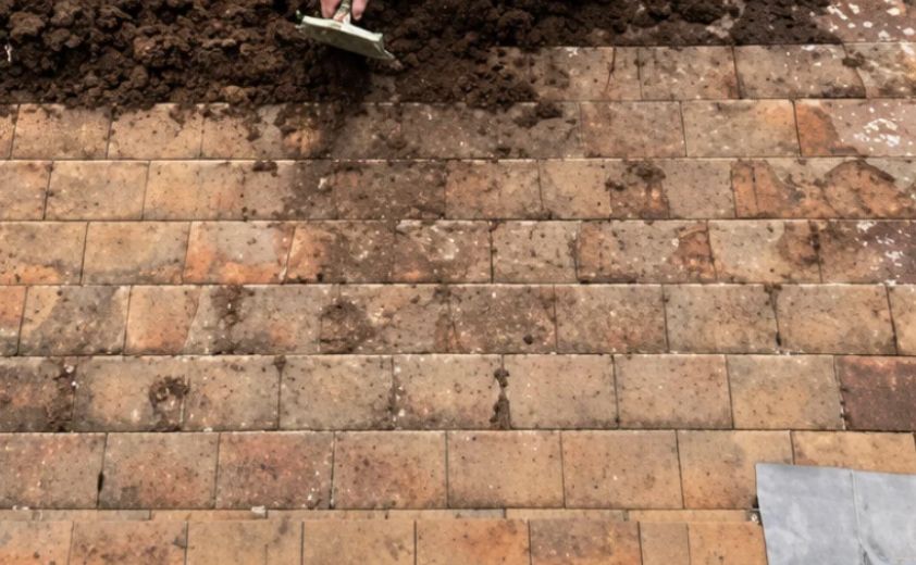Brick steps with dirt before cleaning